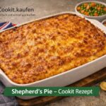 Ein Teller Shepherd’s Pie mit goldbrauner Kartoffelpüree‑Kruste und würziger Hackfleischfüllung.