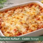Überbackener Tortellini‑Auflauf mit Käse, Schinken und cremiger Soße in einer Auflaufform
